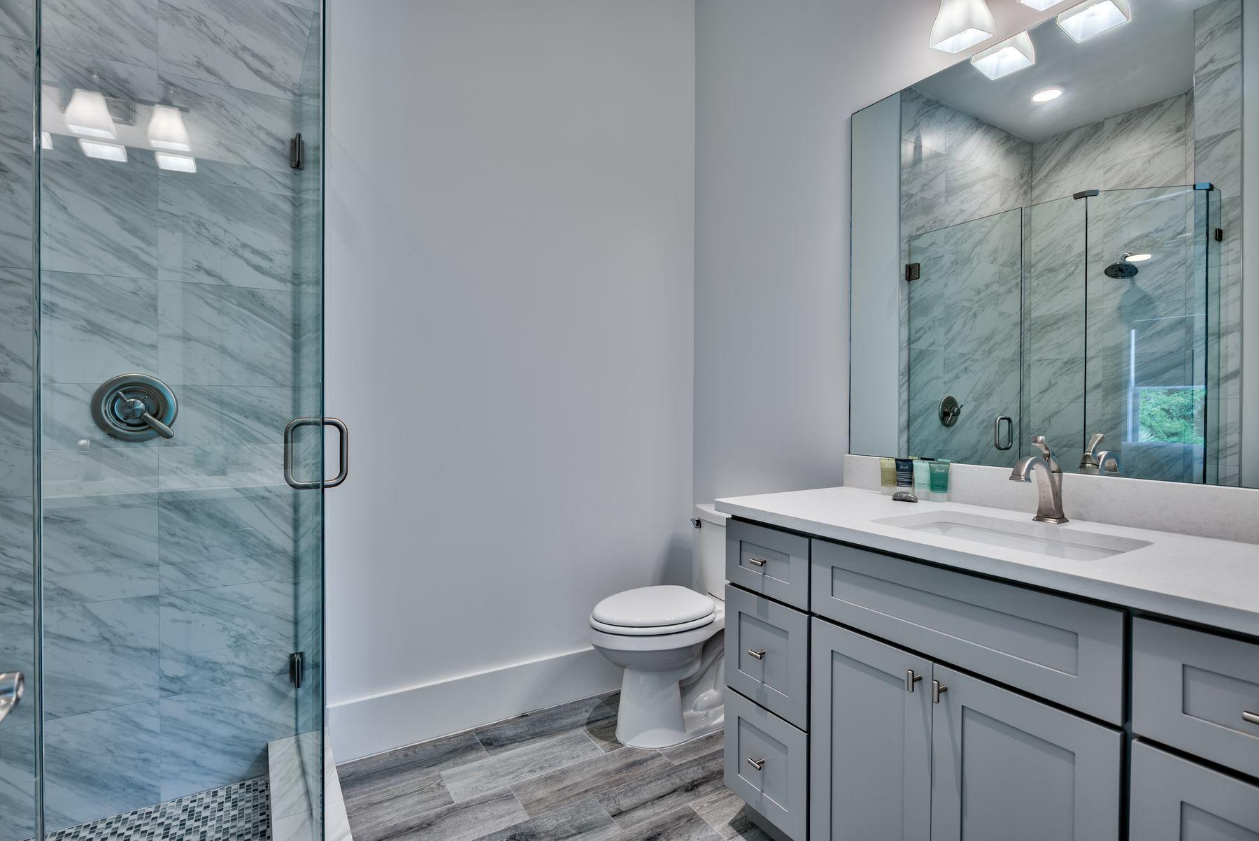 37 West Seahorse Circle Santa Rosa Beach, FL 32459 - Photo 24 of 44 a bathroom with a granite countertop sink a toilet and a mirror