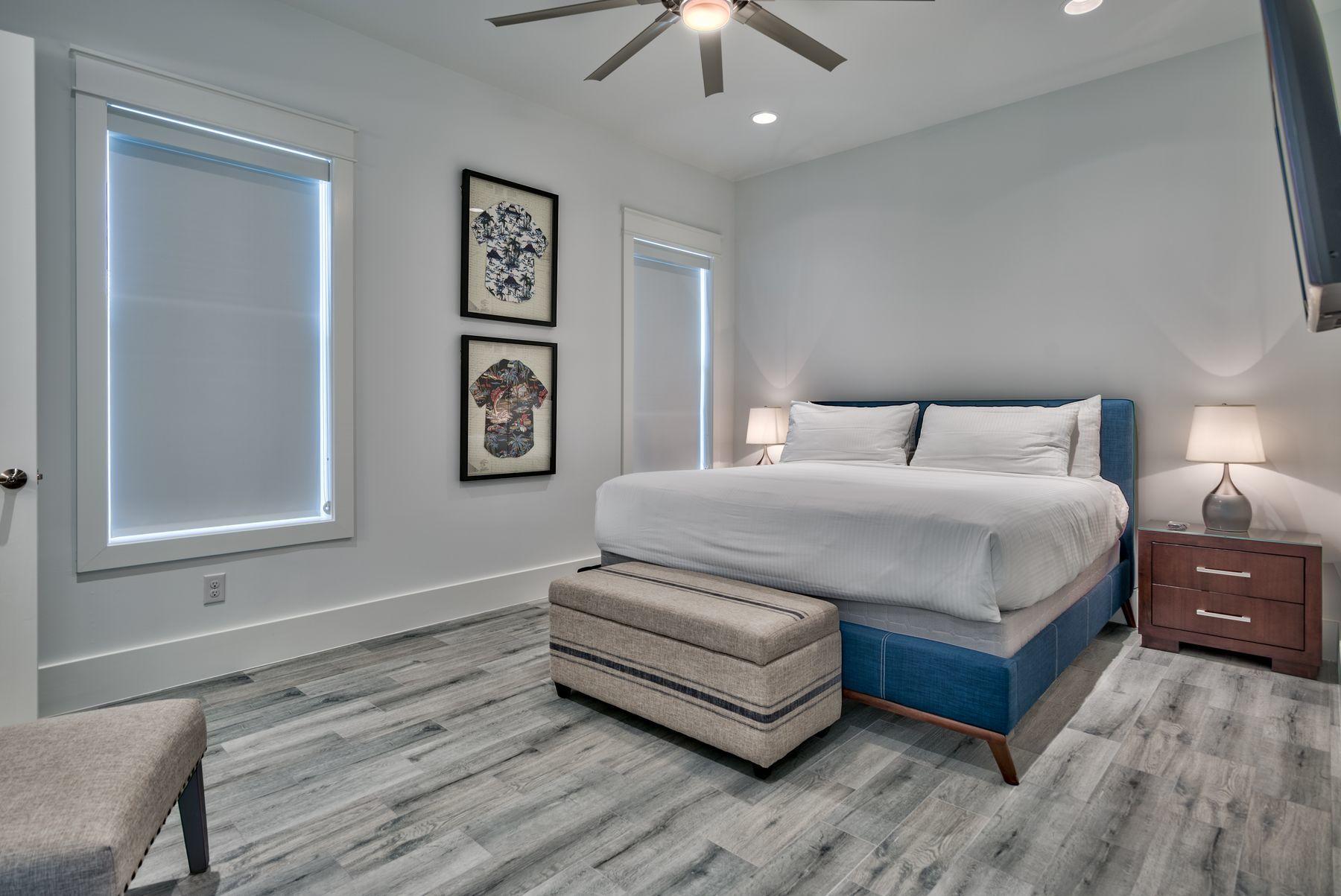 37 West Seahorse Circle Santa Rosa Beach, FL 32459 - Photo 32 of 44 a bedroom with a bed and a chandelier