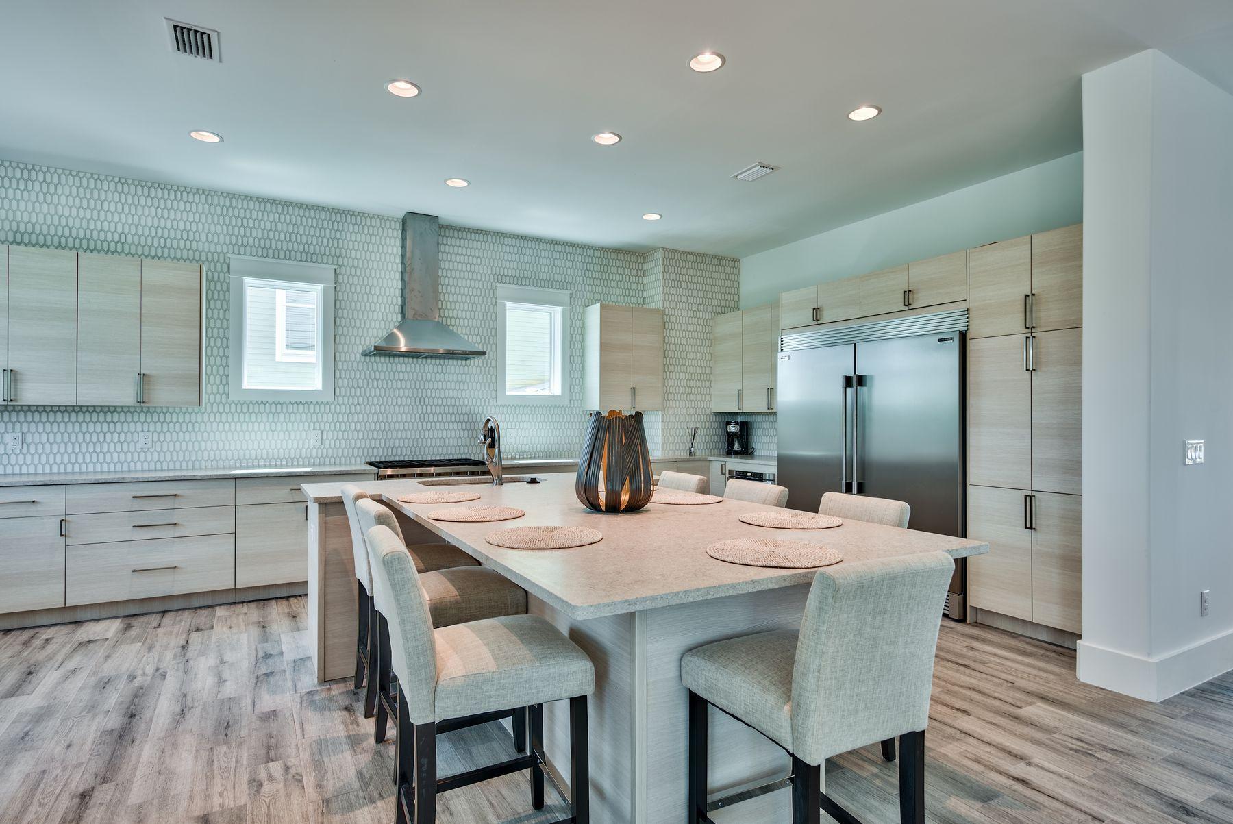 37 West Seahorse Circle Santa Rosa Beach, FL 32459 - Photo 5 of 44 a kitchen with a table and chairs in it