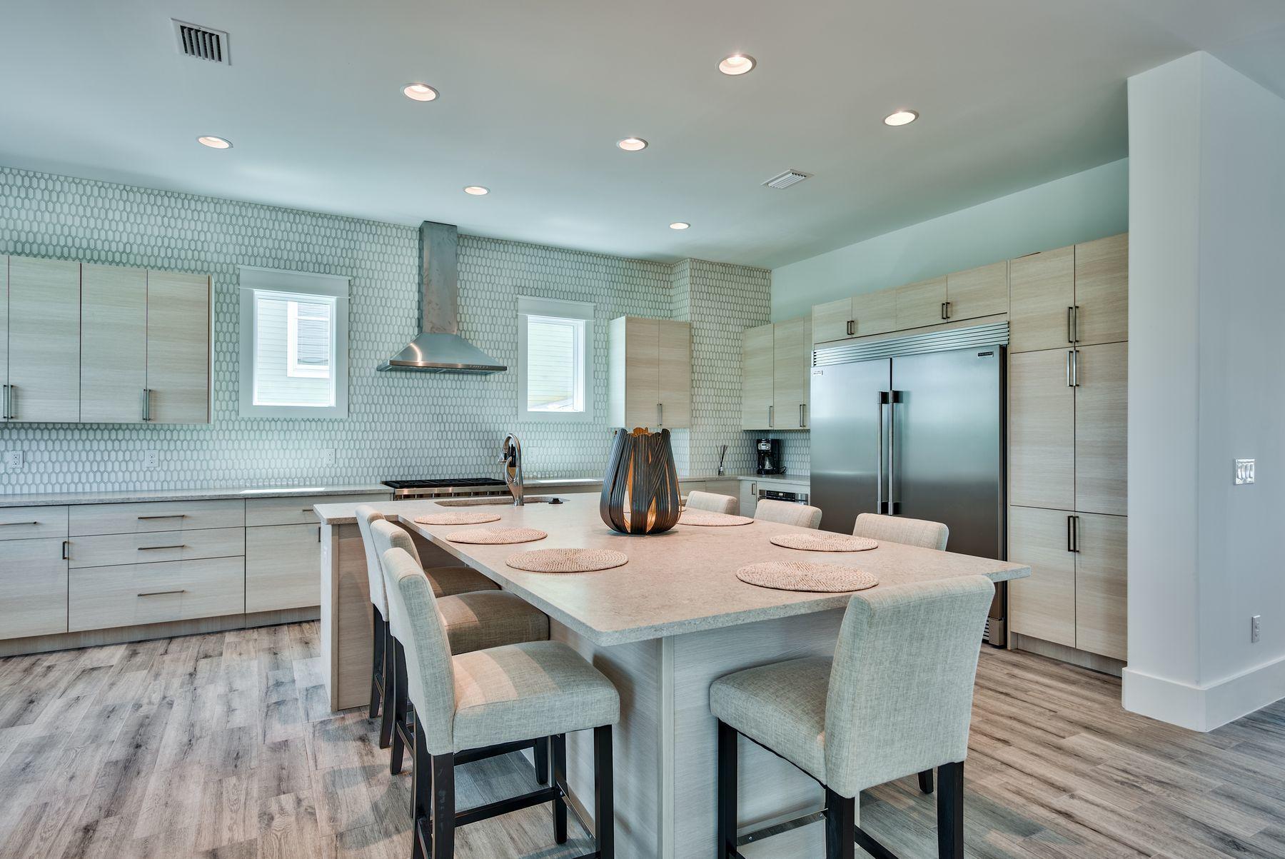 37 West Seahorse Circle Santa Rosa Beach, FL 32459 - Photo 10 of 44 a kitchen with a table and chairs in it