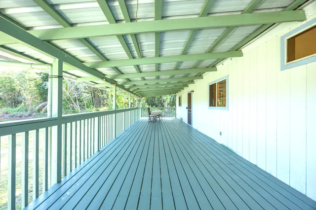 a view of outdoor space with wooden floor