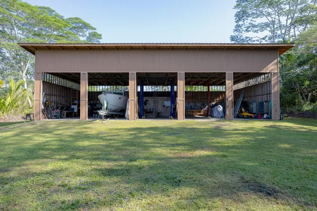 a view of a house with a yard and plants