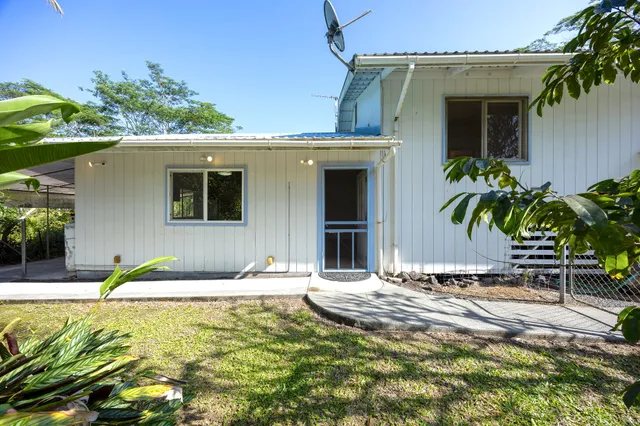 a house with trees in front of it