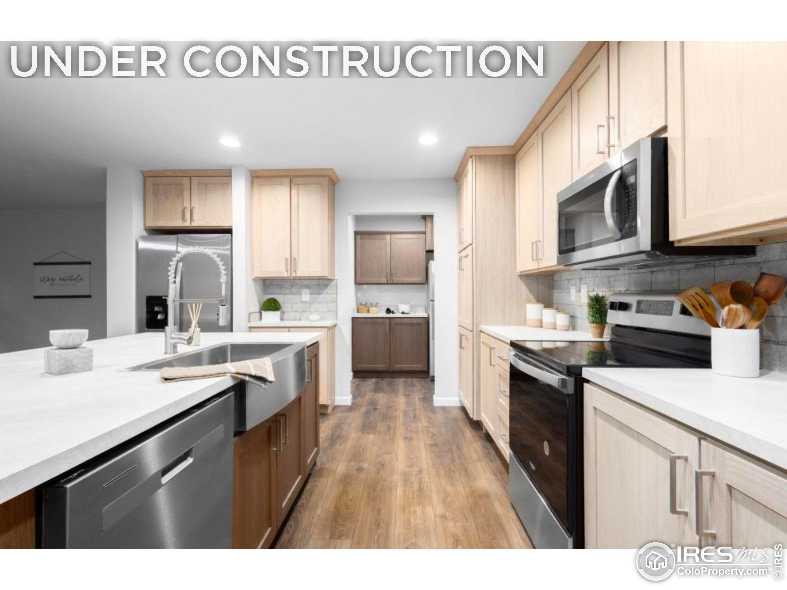 0 3rd Street Carr, CO 80612 - Photo 1 of 8 a kitchen with stainless steel appliances granite countertop a sink stove and refrigerator