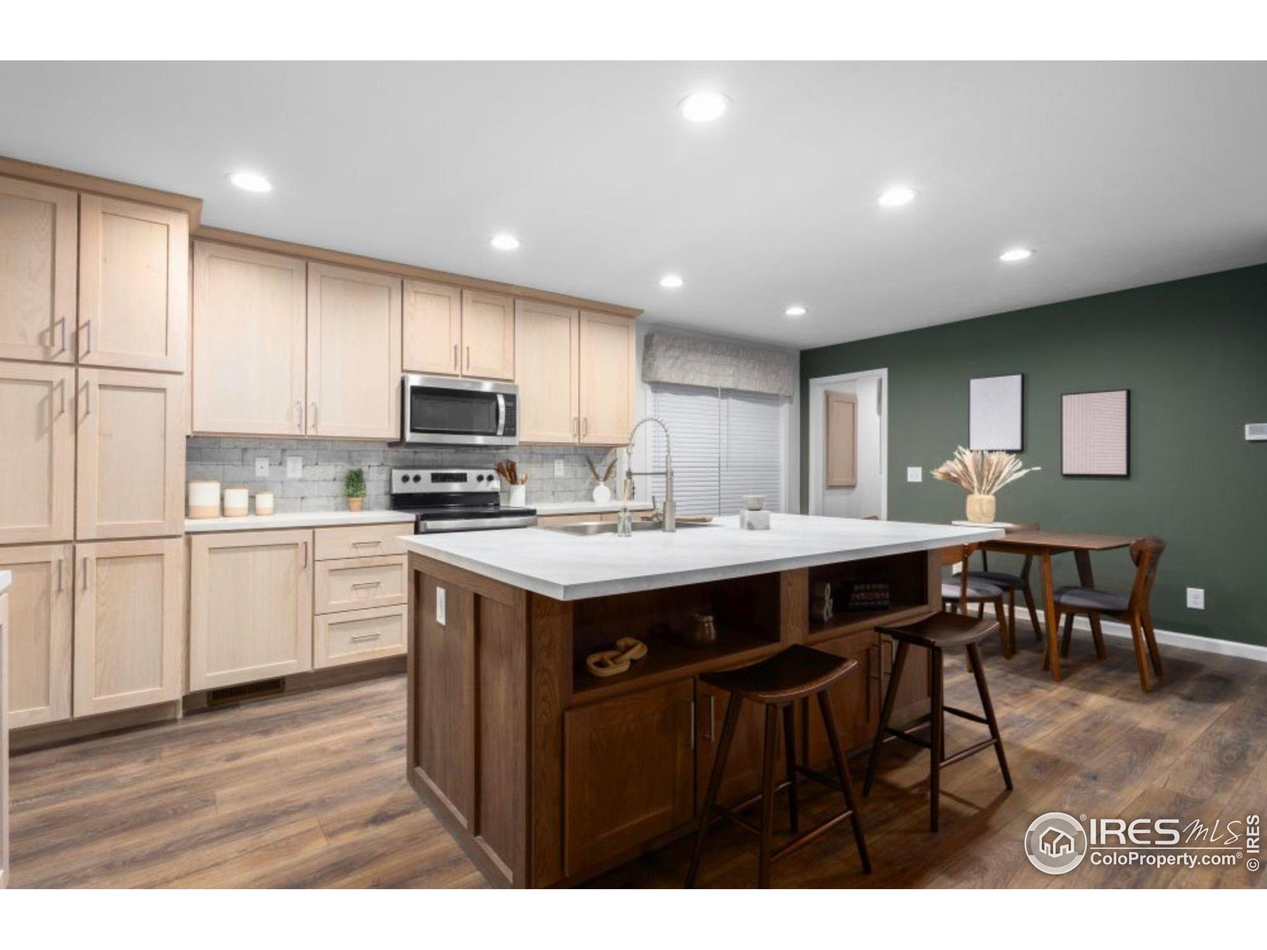 0 3rd Street Carr, CO 80612 - Photo 3 of 8 a kitchen with a sink a counter top space stainless steel appliances and cabinets