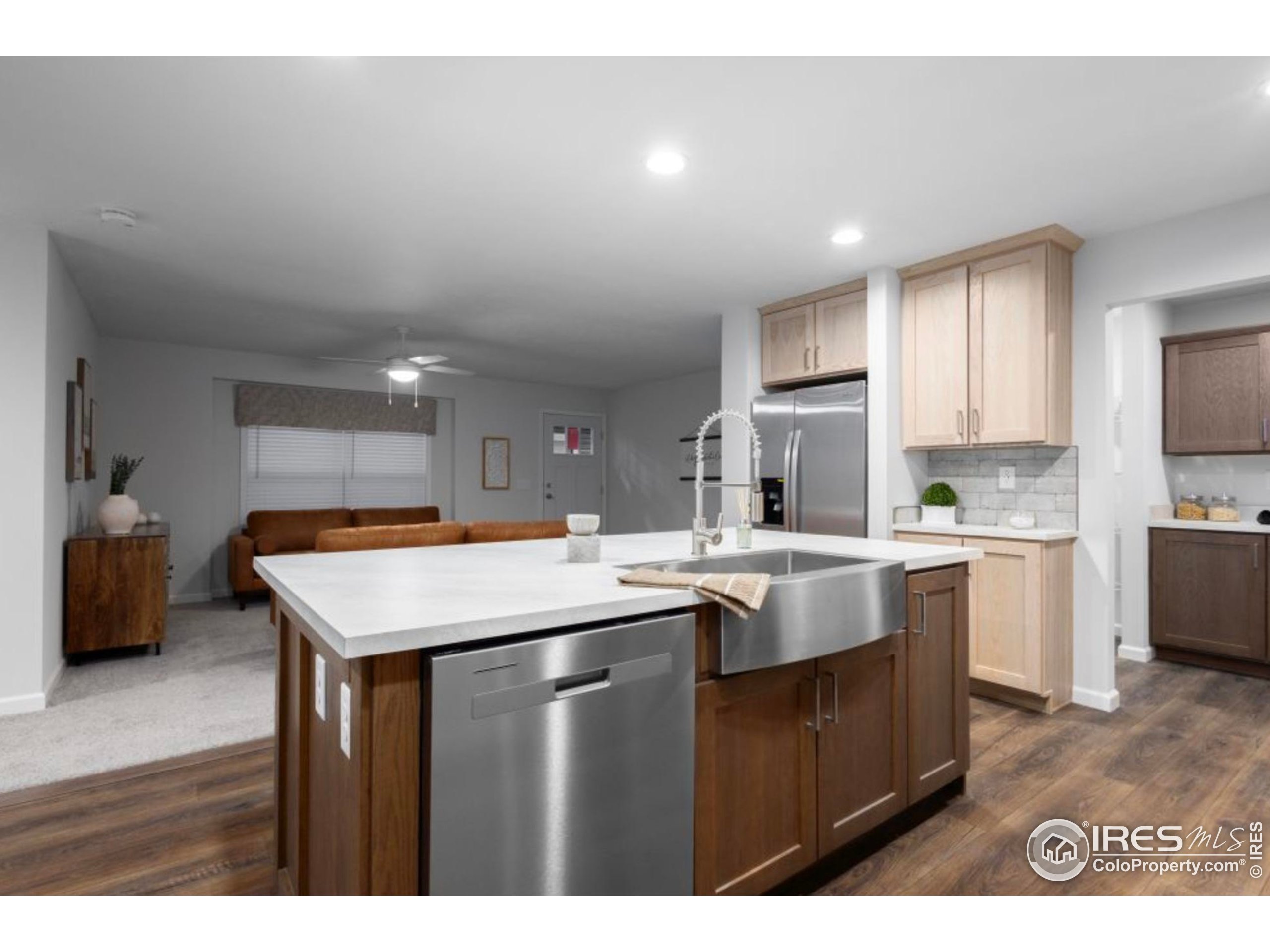 0 3rd Street Carr, CO 80612 - Photo 4 of 8 a kitchen with a sink a counter top space and stainless steel appliances
