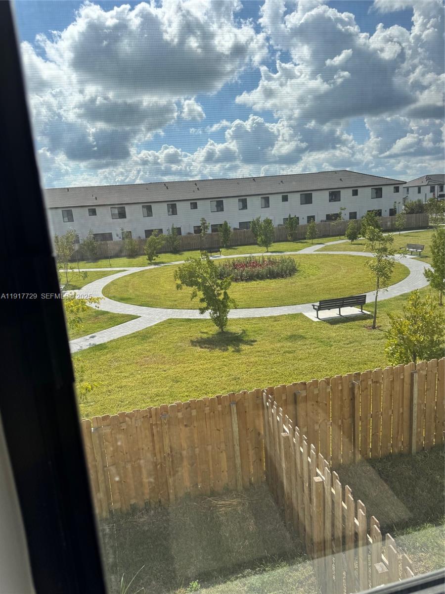 18948 Southwest 344th Terrace, Unit 18948 Homestead, FL 33034 - Photo 16 of 17 a view of a swimming pool with an ocean view