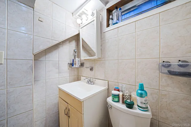 a bathroom with a sink a vanity and bathtub