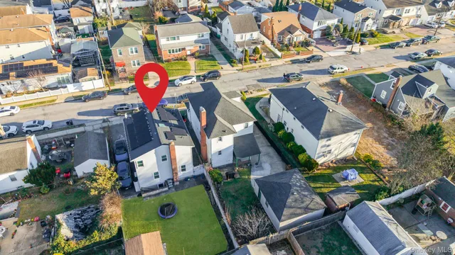 aerial view of a houses with yard