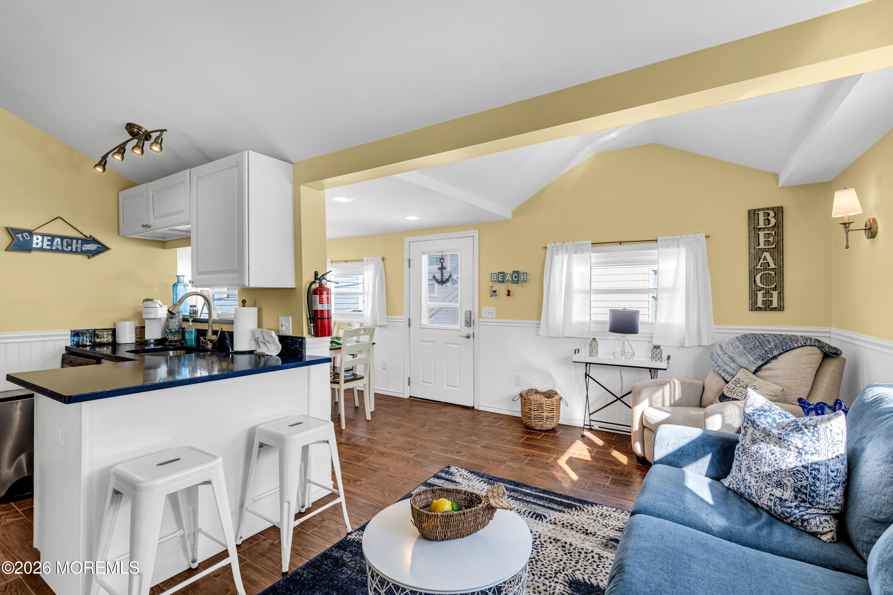 112 West Tide Way Lavallette, NJ 08735 - Photo 2 of 16 a living room with furniture and a wooden floor