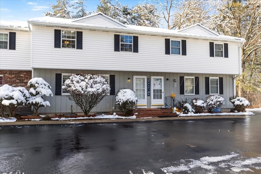 104 Newcomb Street, Unit E Norton, MA 02766 - Photo 14 of 21 a front view of a house with swimming pool and porch