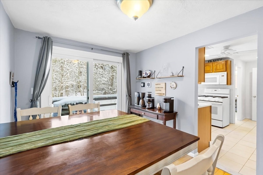 104 Newcomb Street, Unit E Norton, MA 02766 - Photo 5 of 21 a bedroom with a bed and a view of living room