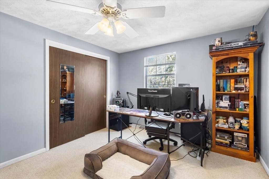 104 Newcomb Street, Unit E Norton, MA 02766 - Photo 8 of 21 a workspace with a bookshelf