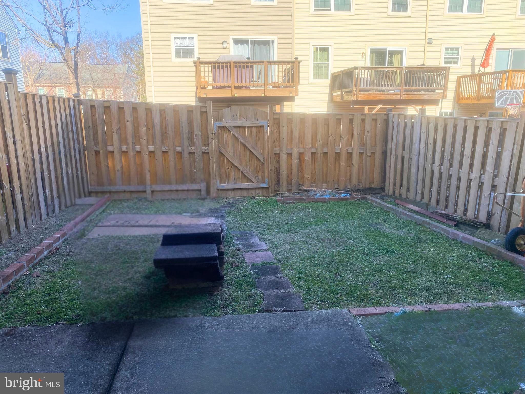 7416 Rhondda Drive, Unit BASEMENT APARTMENT Lorton, VA 22079 - Photo 11 of 11 a view of a backyard with a garden
