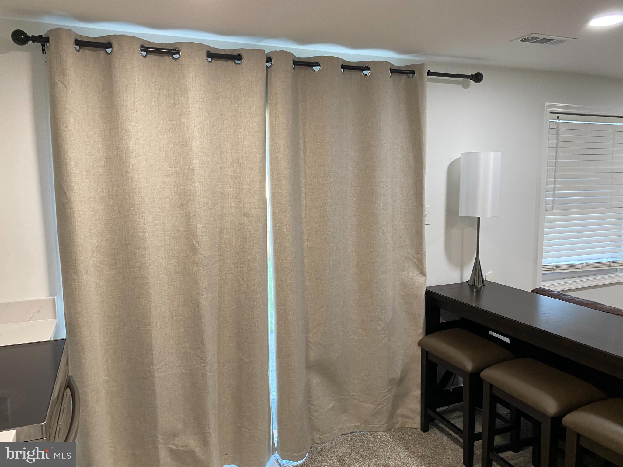 7416 Rhondda Drive, Unit BASEMENT APARTMENT Lorton, VA 22079 - Photo 4 of 11 a bathroom with a shower curtain and a sink