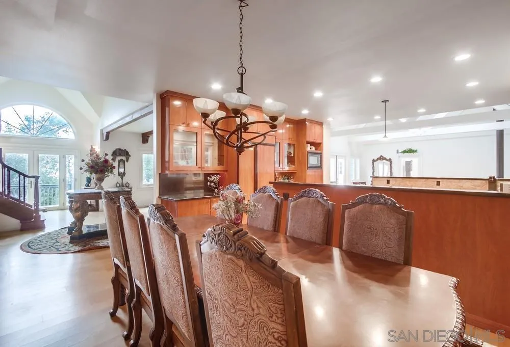 4499 Toyon Mountain Road Julian, CA 92036 - Photo 12 of 50 a large room with kitchen island stainless steel appliances refrigerator a dining table and chairs