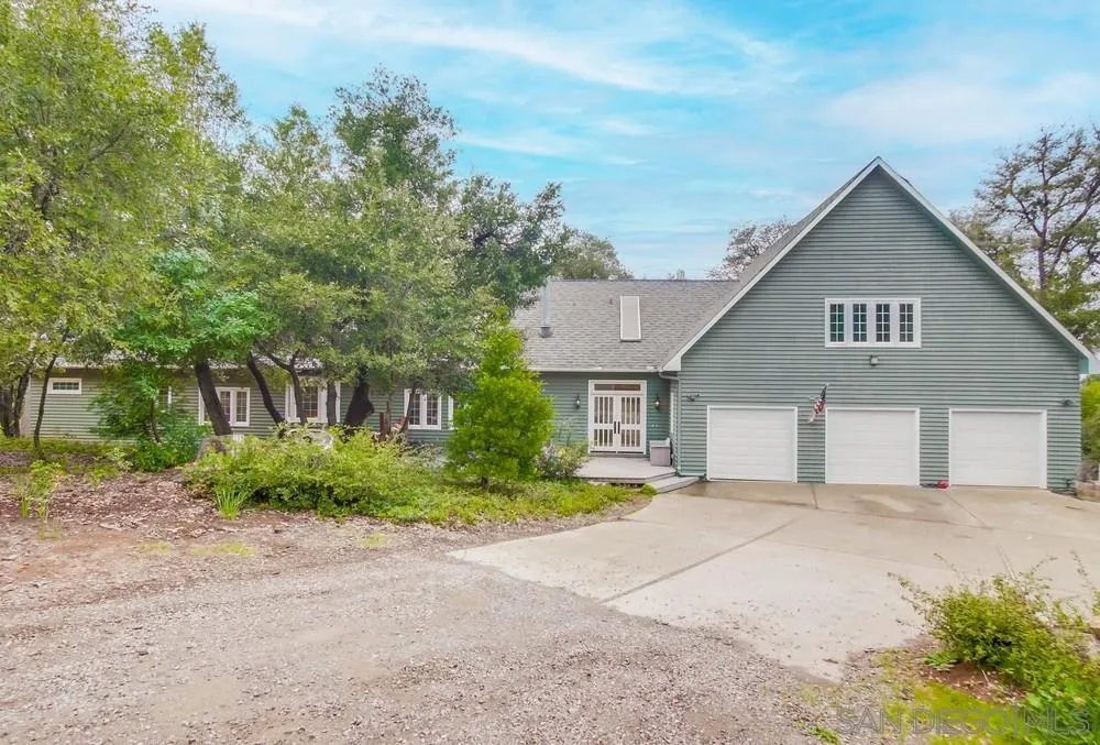 4499 Toyon Mountain Road Julian, CA 92036 - Photo 2 of 50 a front view of a house with a yard and trees