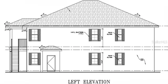 a black white and white photo of a white building