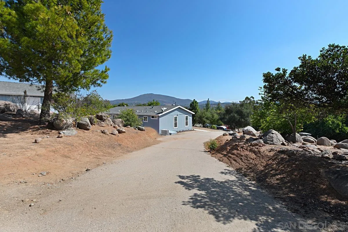 1064 Ranchito Vista Alpine, CA 91901 - Photo 1 of 31 a view of a dirt road with a building in the background
