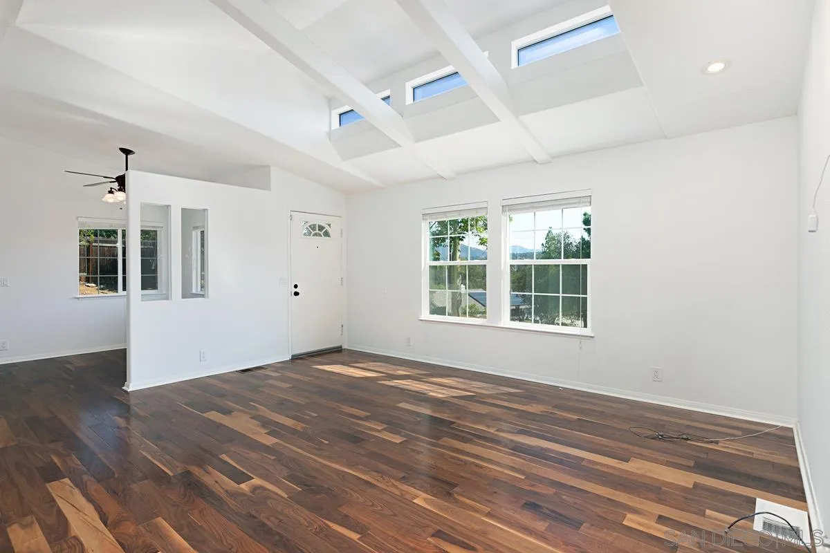 1064 Ranchito Vista Alpine, CA 91901 - Photo 12 of 31 a view of an empty room with wooden floor and a window