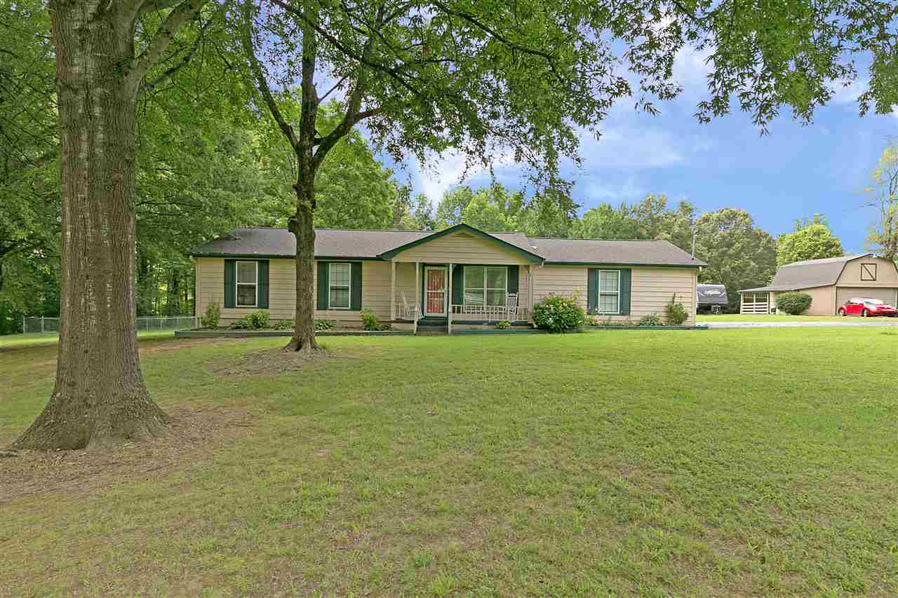 876 Cotton Grove Road Jackson, TN 38305 - Photo 1 of 1 a front view of a house with a garden