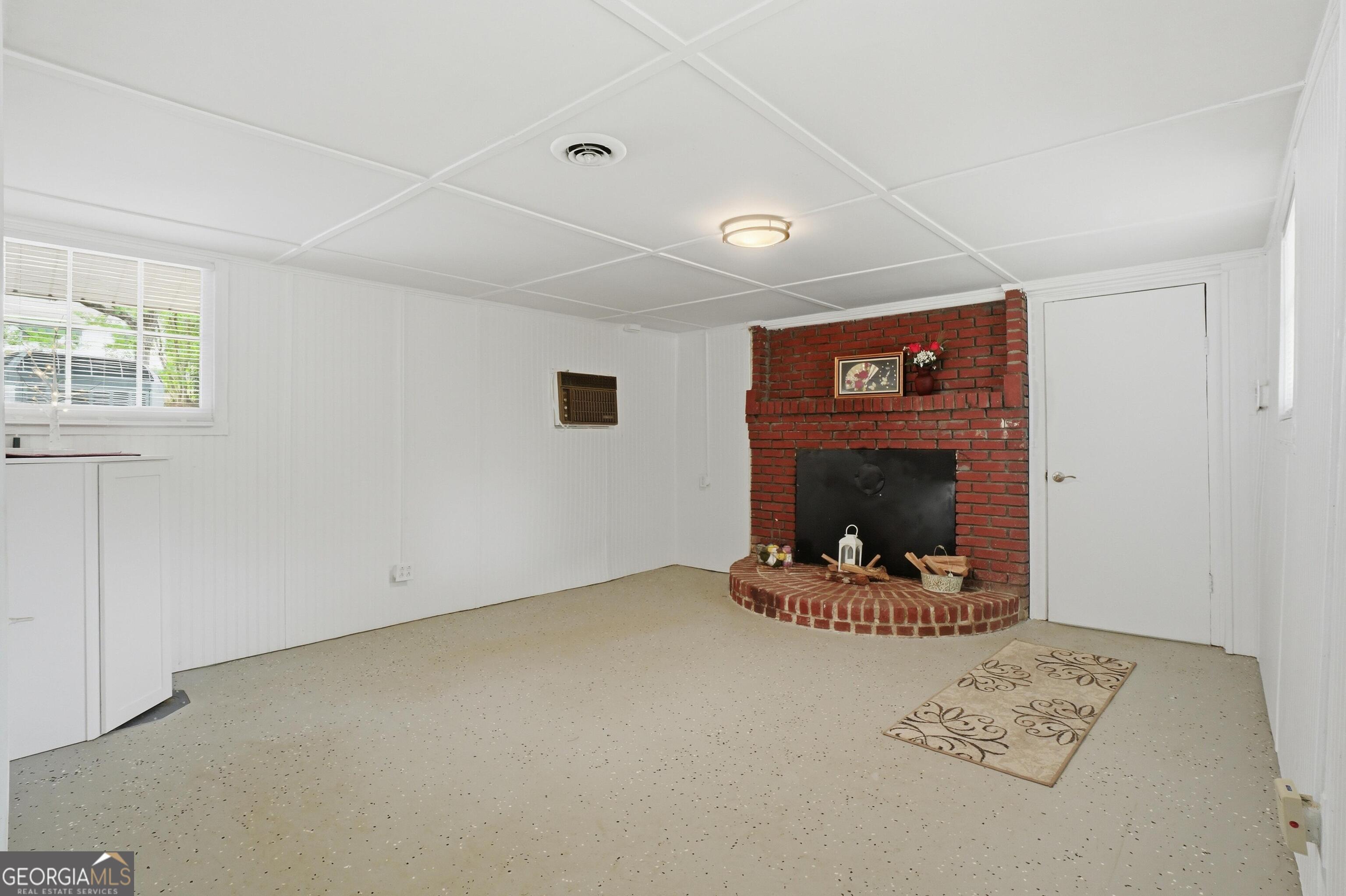 3022 Maple Road Southeast Lindale, GA 30147 - Photo 24 of 29 a living room with furniture and a fireplace