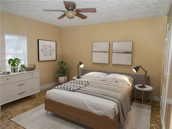 a bedroom with a bed and a window