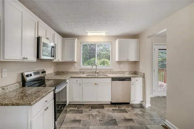 a bathroom with a sink toilet and mirror