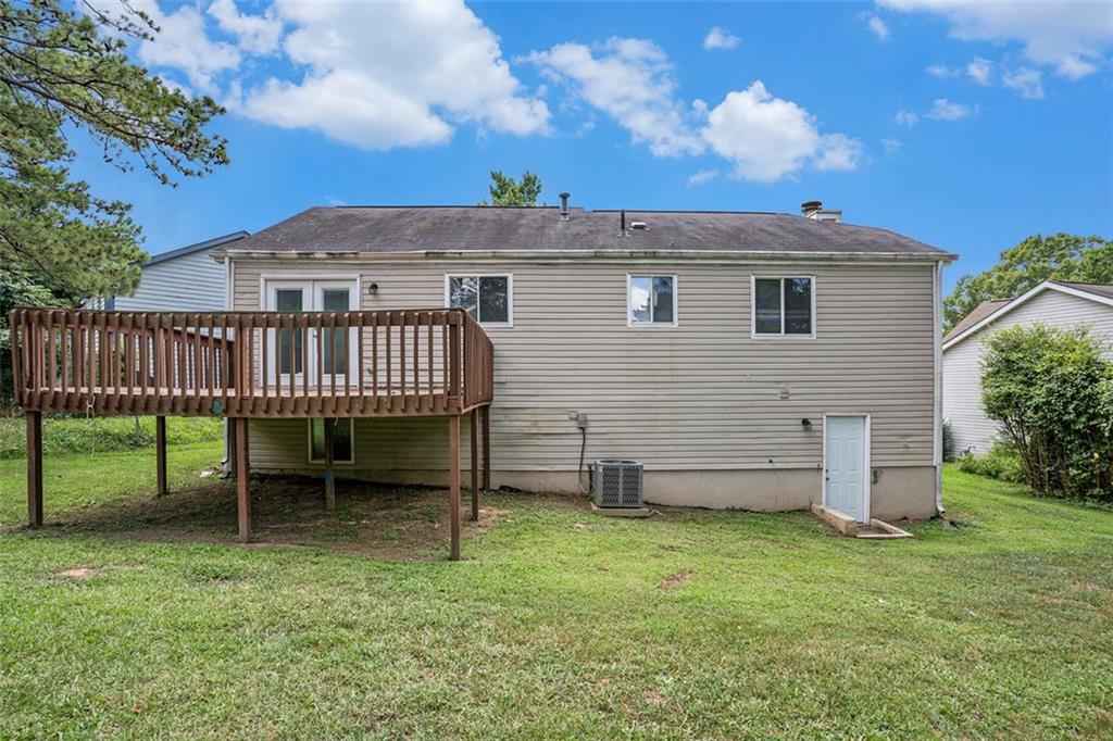 2039 Raintree Place Lithonia, GA 30058 - Photo 17 of 18 front view of a house with a yard