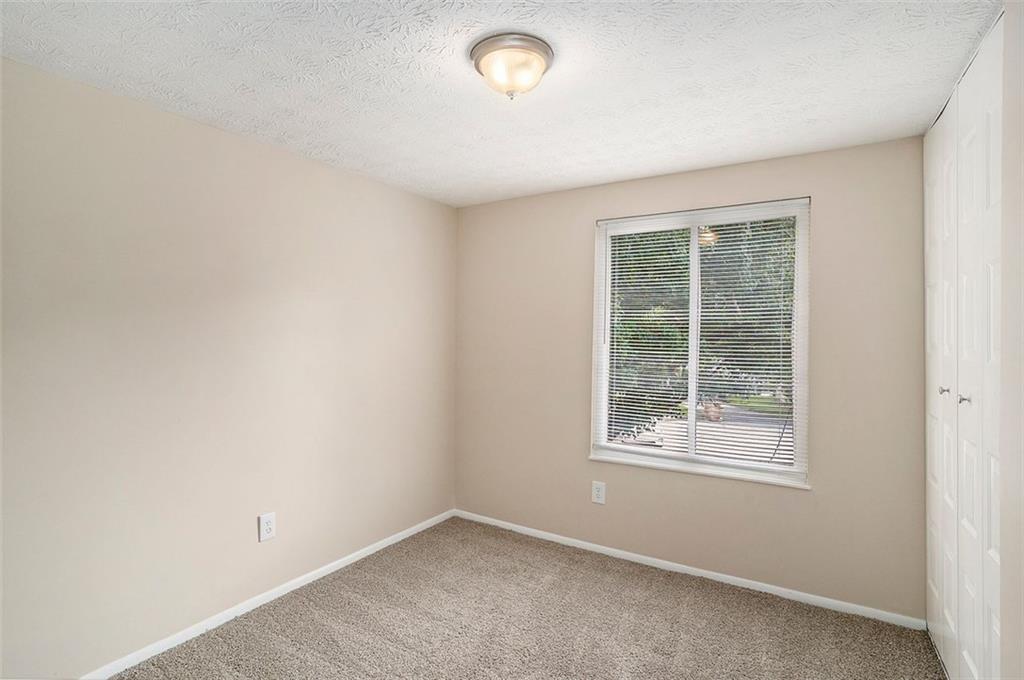 2039 Raintree Place Lithonia, GA 30058 - Photo 2 of 18 an empty room with a window