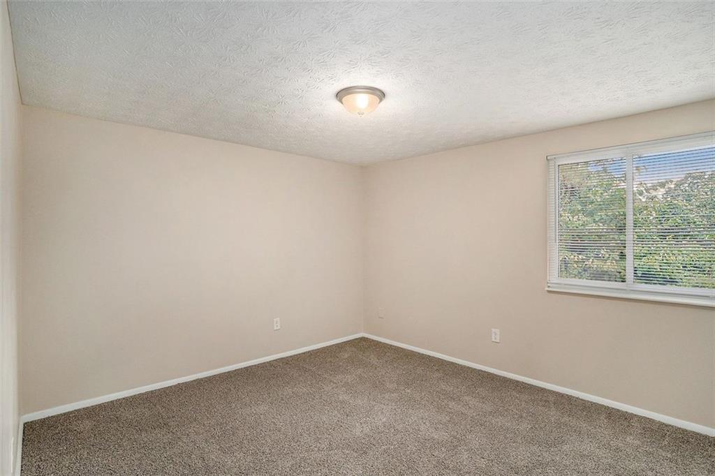 2039 Raintree Place Lithonia, GA 30058 - Photo 5 of 18 an empty room with a window