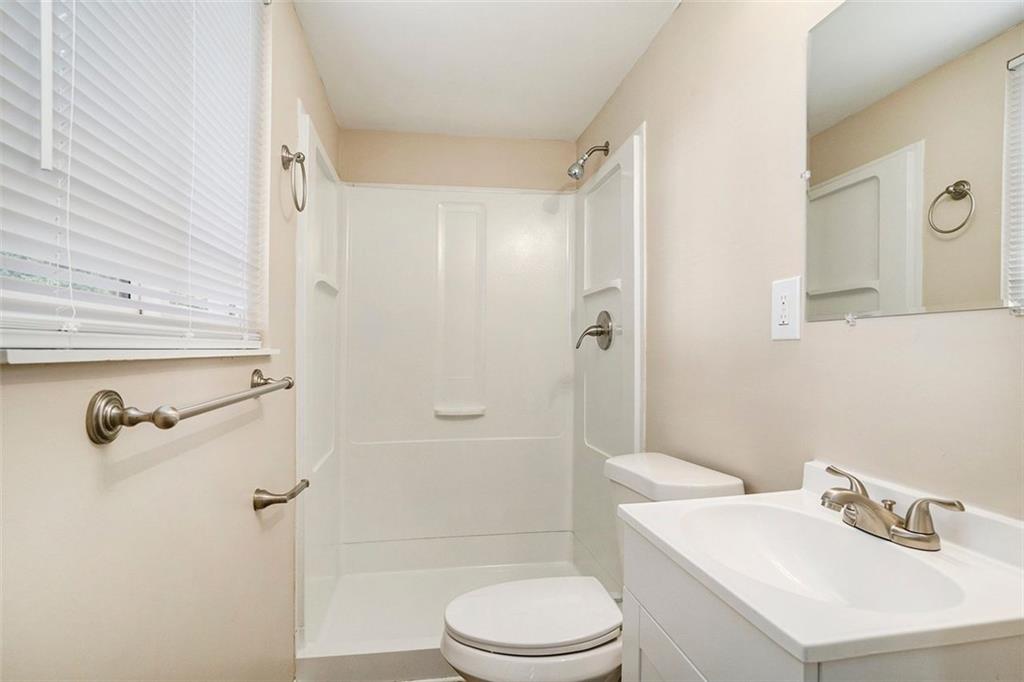 2039 Raintree Place Lithonia, GA 30058 - Photo 7 of 18 a bathroom with a sink toilet and shower
