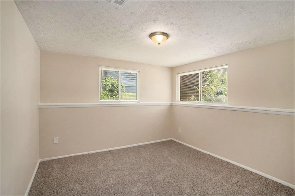 2039 Raintree Place Lithonia, GA 30058 - Photo 8 of 18 an empty room with a window