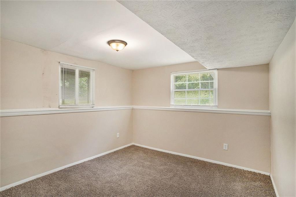 2039 Raintree Place Lithonia, GA 30058 - Photo 9 of 18 an empty room with a window