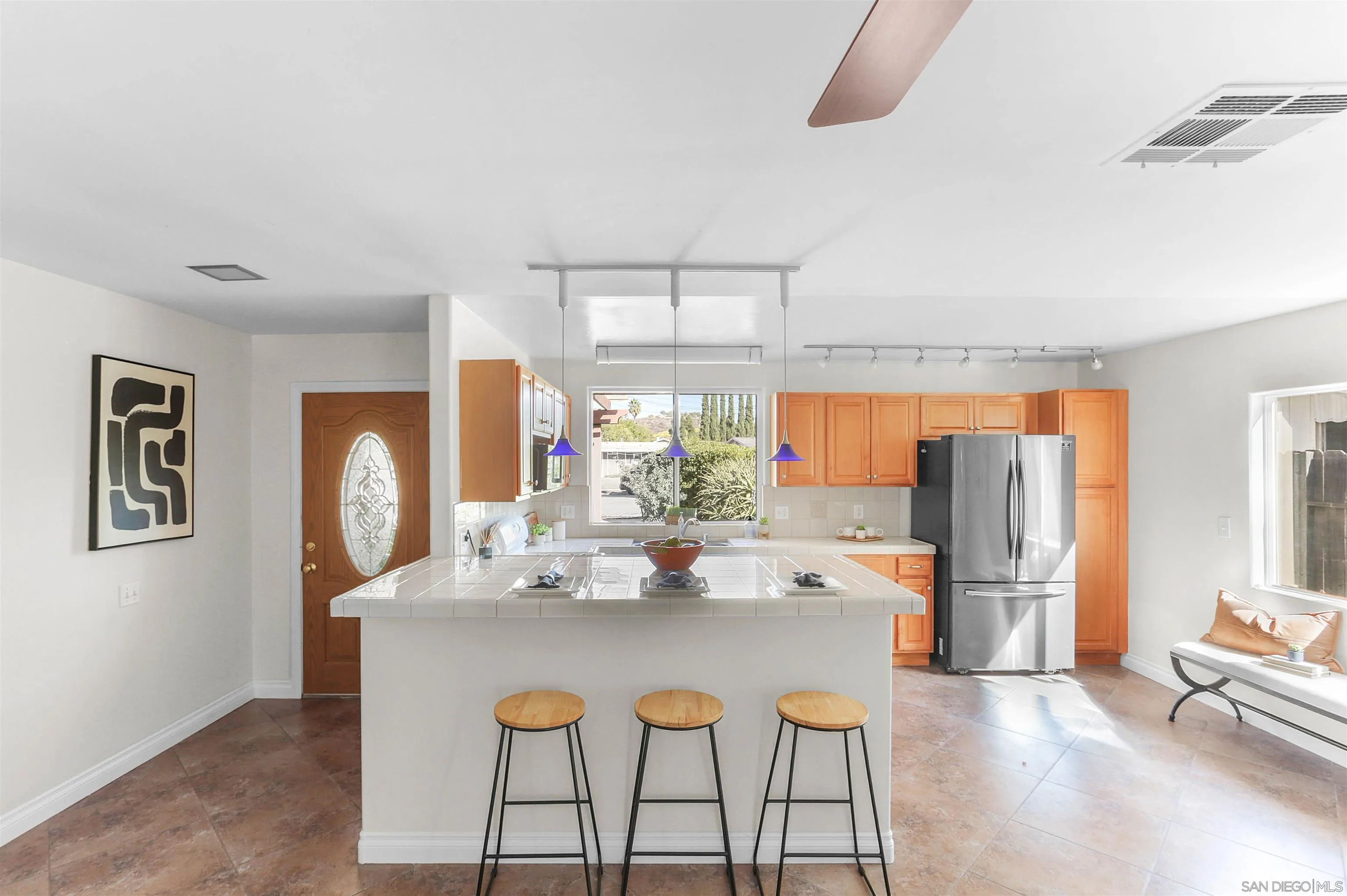 14287 Lolin Lane Poway, CA 92064 - Photo 11 of 35 a dining room with furniture and window