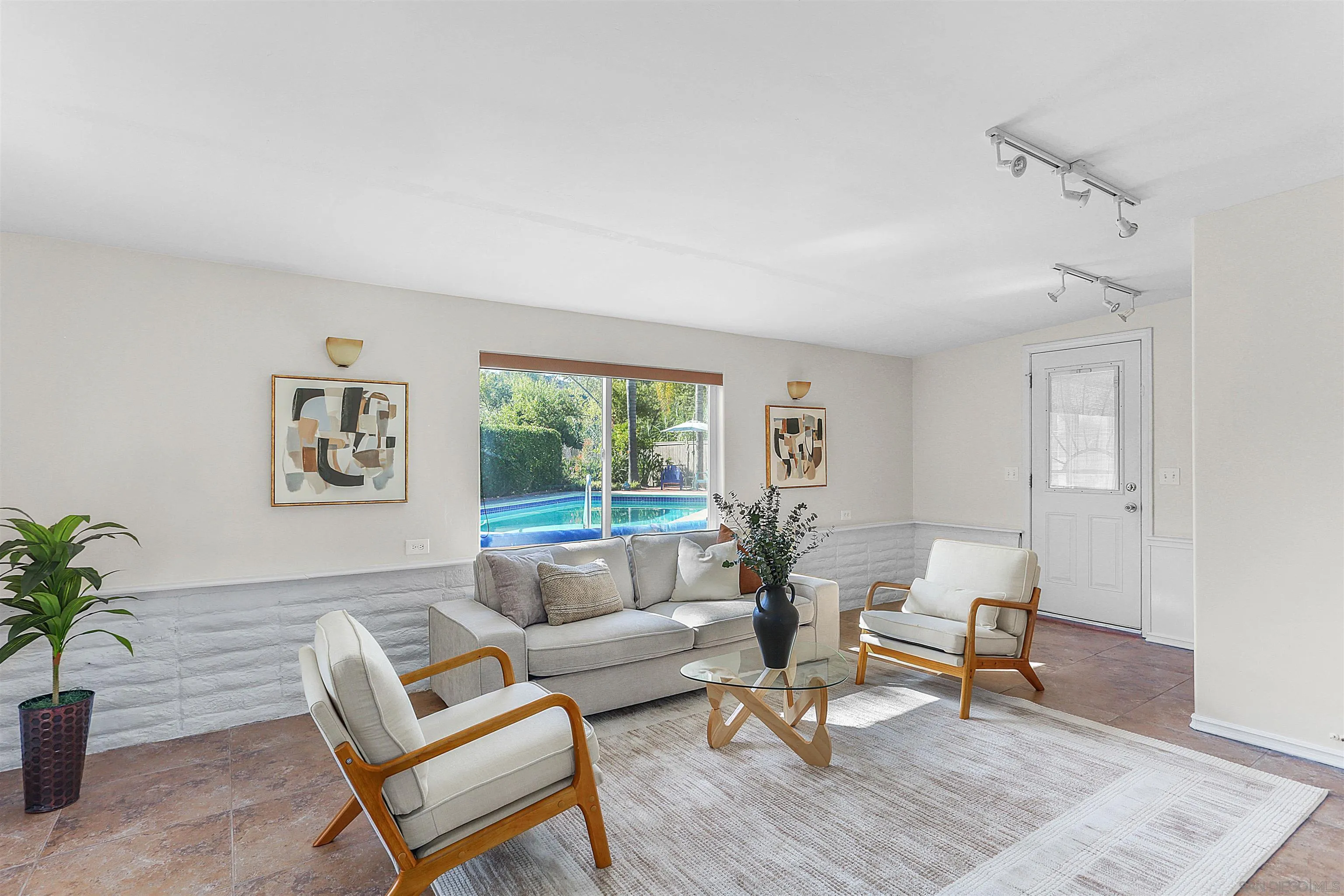 14287 Lolin Lane Poway, CA 92064 - Photo 13 of 35 a living room with furniture and a potted plant