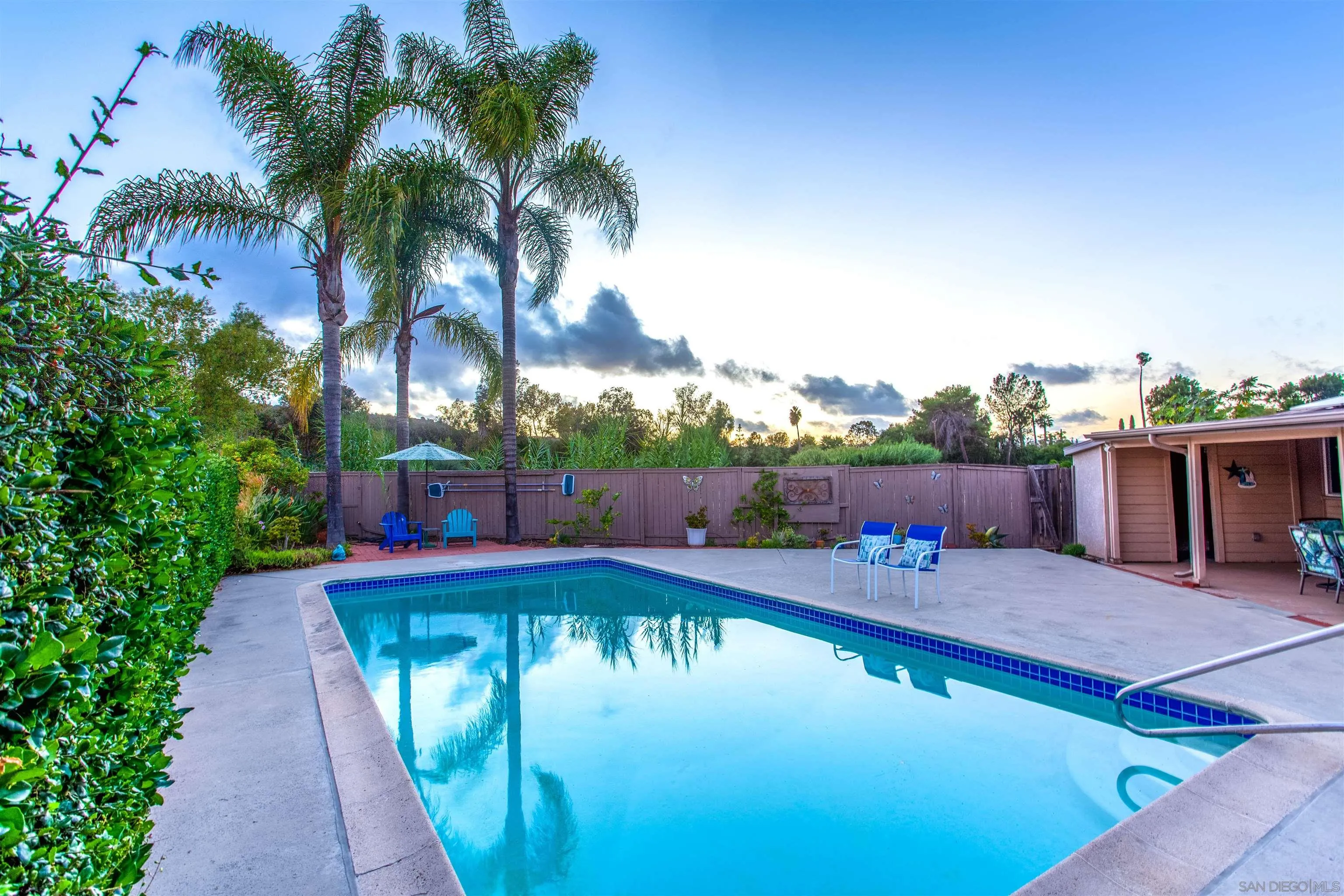 14287 Lolin Lane Poway, CA 92064 - Photo 25 of 35 a view of a swimming pool with a patio and a yard