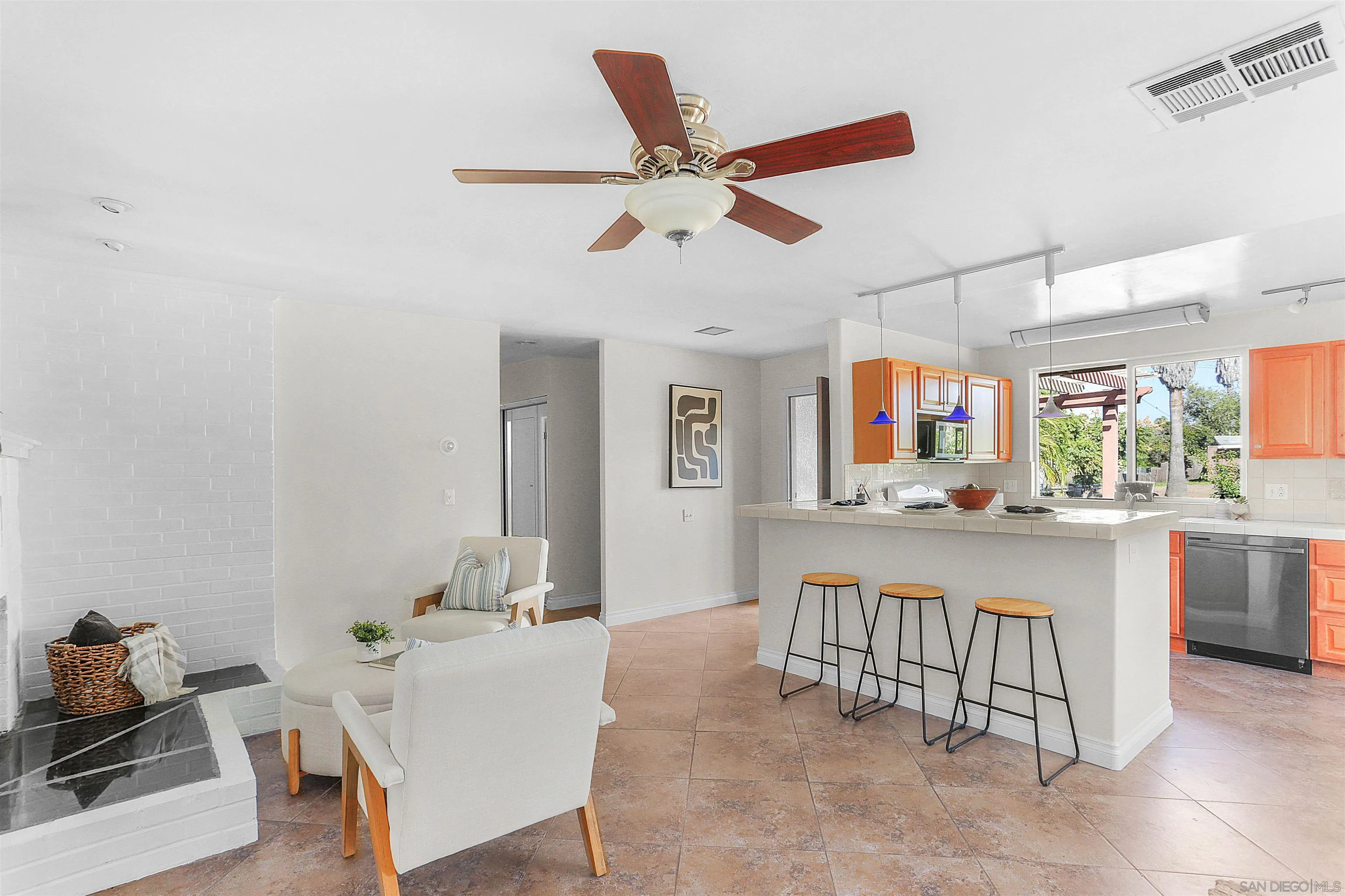 14287 Lolin Lane Poway, CA 92064 - Photo 9 of 35 a living room with kitchen island furniture and a chandelier