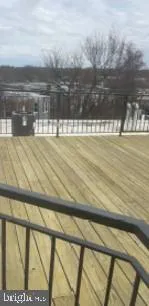 a view of swimming pool with outdoor seating