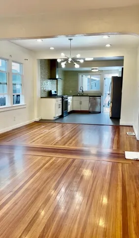 a view of kitchen with cabinets and outdoor space