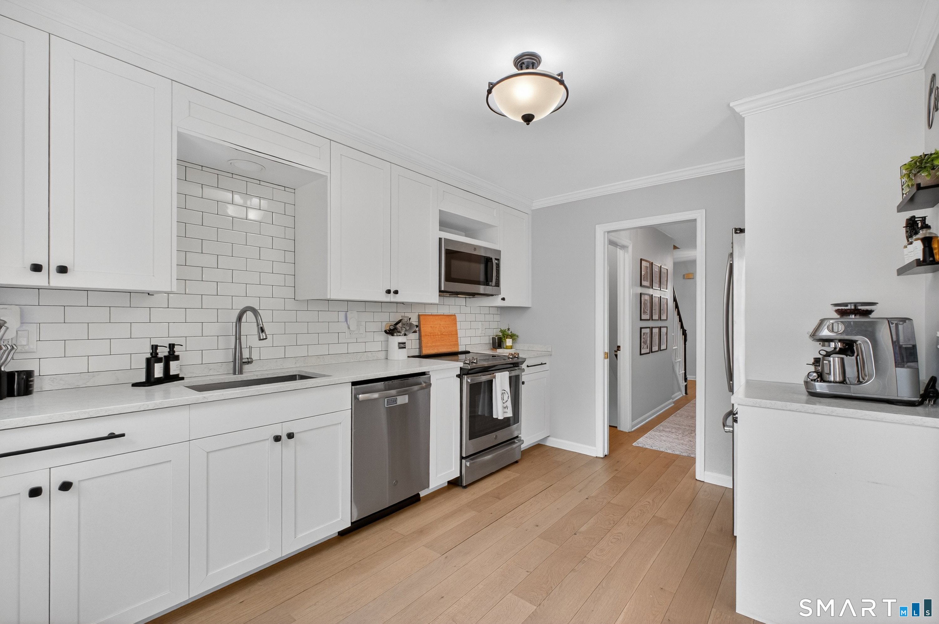 19 Prospect Ridge, Unit 41 Ridgefield, CT 06877 - Photo 15 of 29 a kitchen with stainless steel appliances granite countertop a sink dishwasher stove and refrigerator