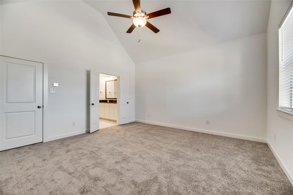 208 Venice Avenue Flower Mound, TX 75028 - Photo 11 of 17 an empty room with windows and cabinet