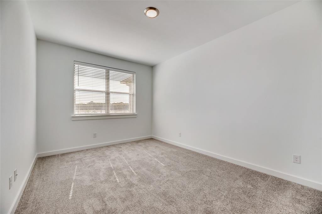 208 Venice Avenue Flower Mound, TX 75028 - Photo 13 of 17 an empty room with a window