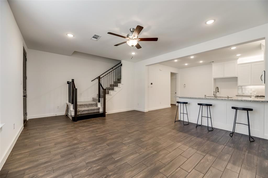 208 Venice Avenue Flower Mound, TX 75028 - Photo 4 of 17 a view of an empty room with a kitchen