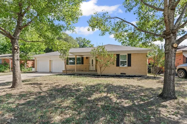 a house with trees in the background