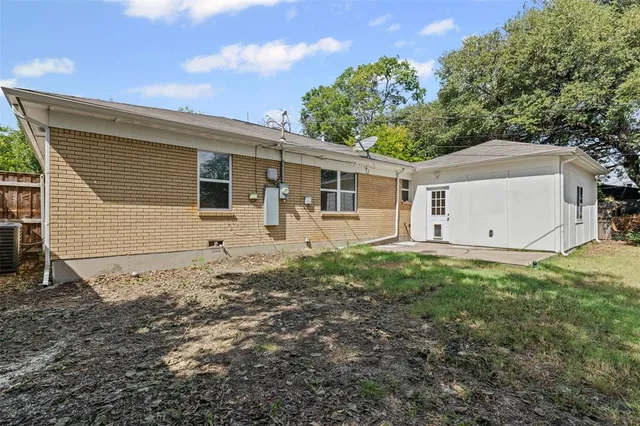 a backyard of a house with lots of green space