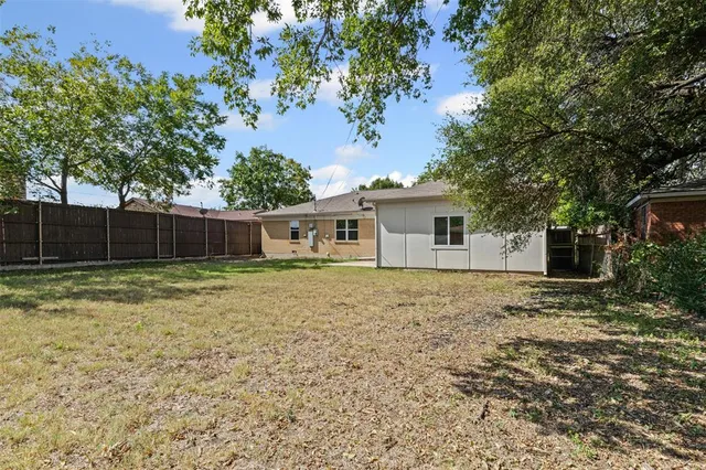a backyard of a house with garden