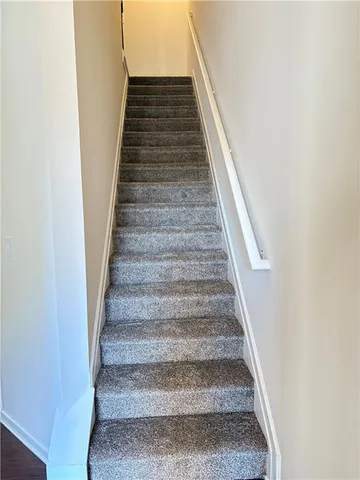 a view of an empty room with windows