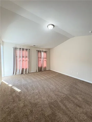 a large bathroom with a tub a sink and mirror