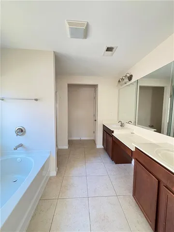 a white bath tub sitting next to a window